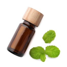 Photo of Bottle of essential oil and mint isolated on white, top view