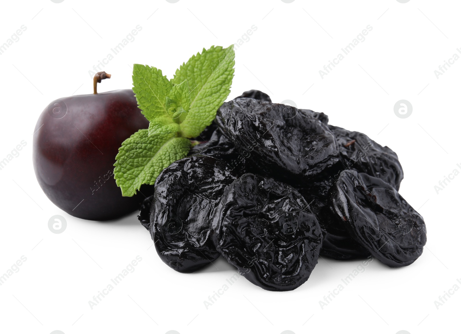 Photo of Delicious prunes, fresh ripe plums and mint isolated on white