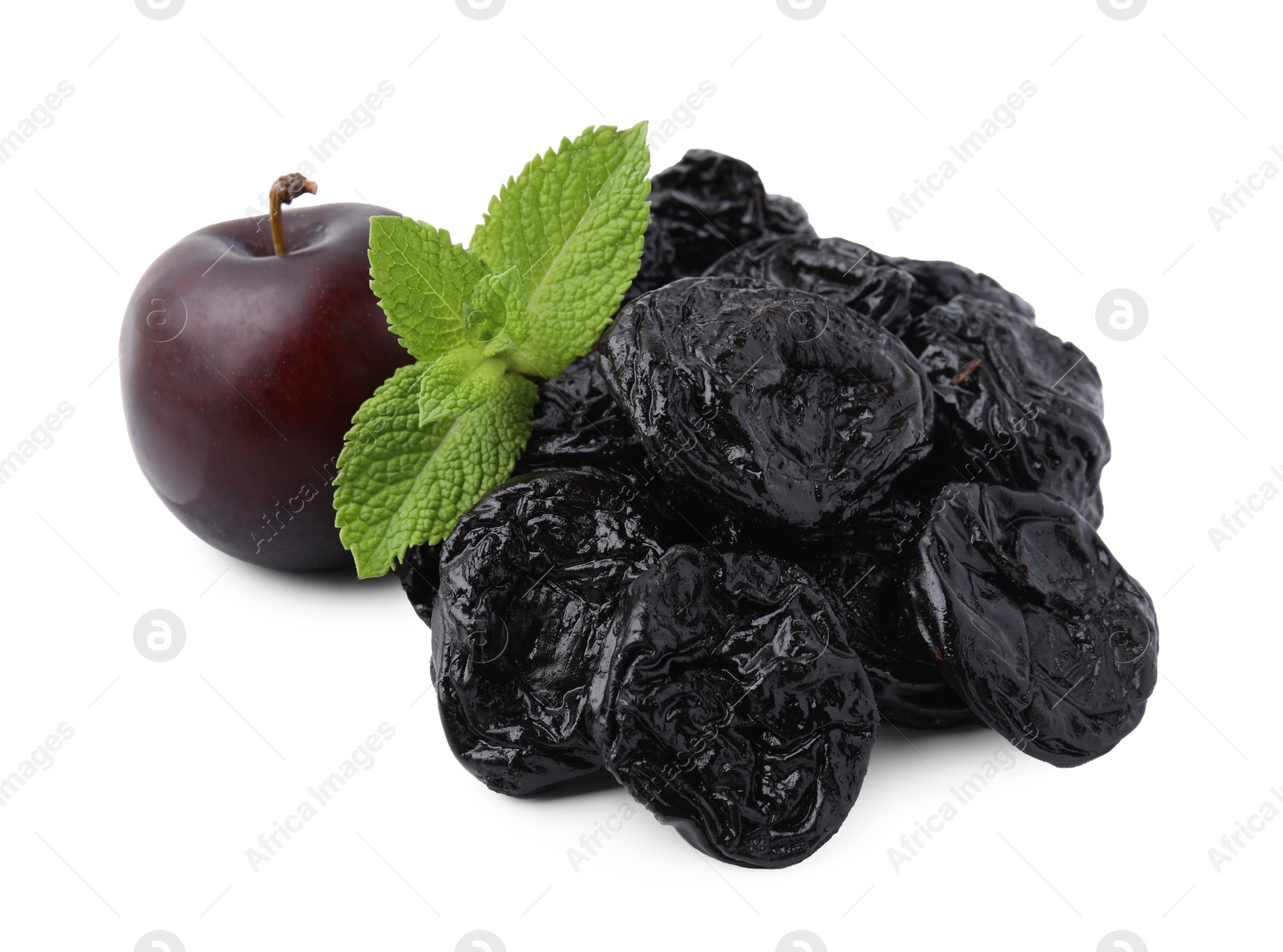 Photo of Delicious prunes, fresh ripe plums and mint isolated on white