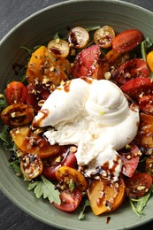 Photo of Fresh delicious burrata salad on table, top view