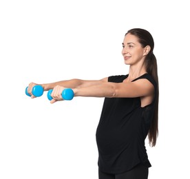 Beautiful pregnant woman with dumbbells doing exercises on white background