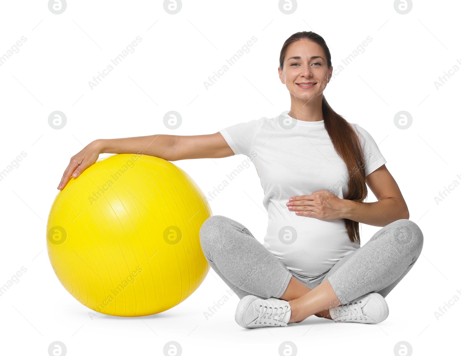 Photo of Beautiful pregnant woman with fitball isolated on white