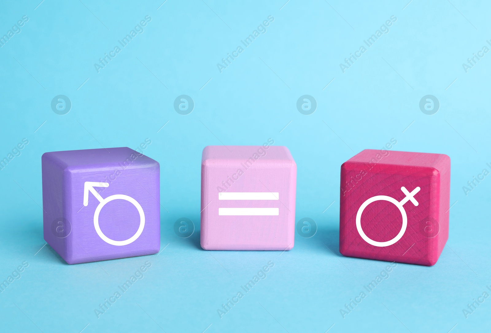 Image of Cube with equals sign between female and male gender symbols on light blue background