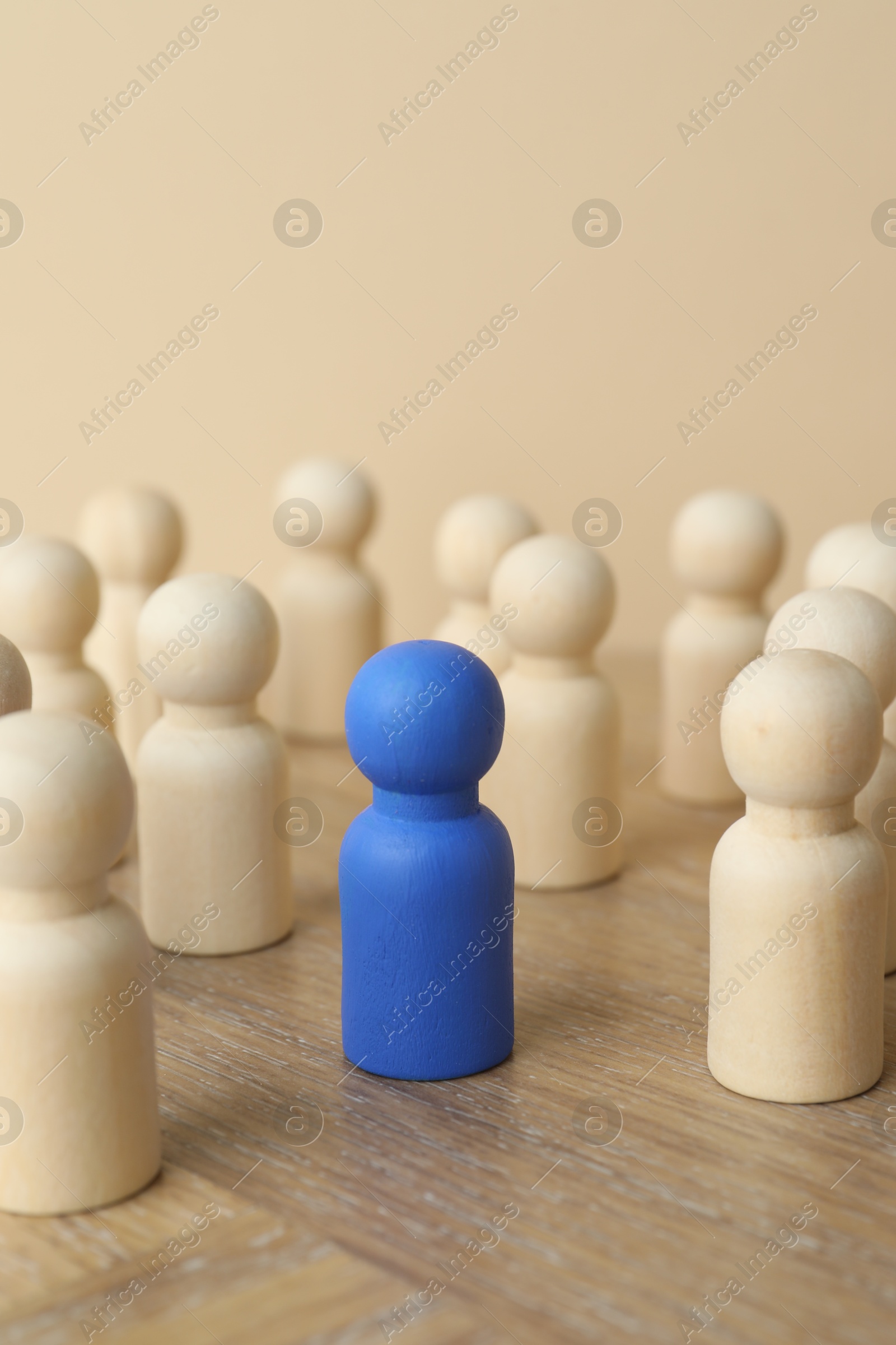 Photo of Blue piece among wooden ones on table