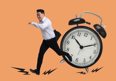 Image of Businessman running away from alarm clock on dark beige background. Time concept