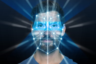 Facial recognition system. Scanning man's face for authentication