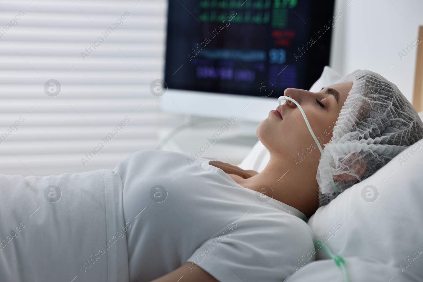 Photo of Coma patient. Young woman sleeping in hospital bed