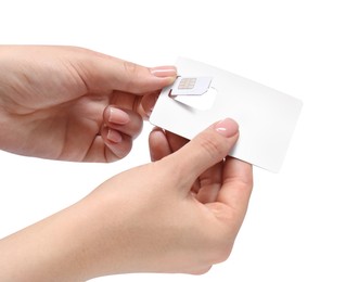 Photo of Woman removing SIM card from holder on white background, closeup