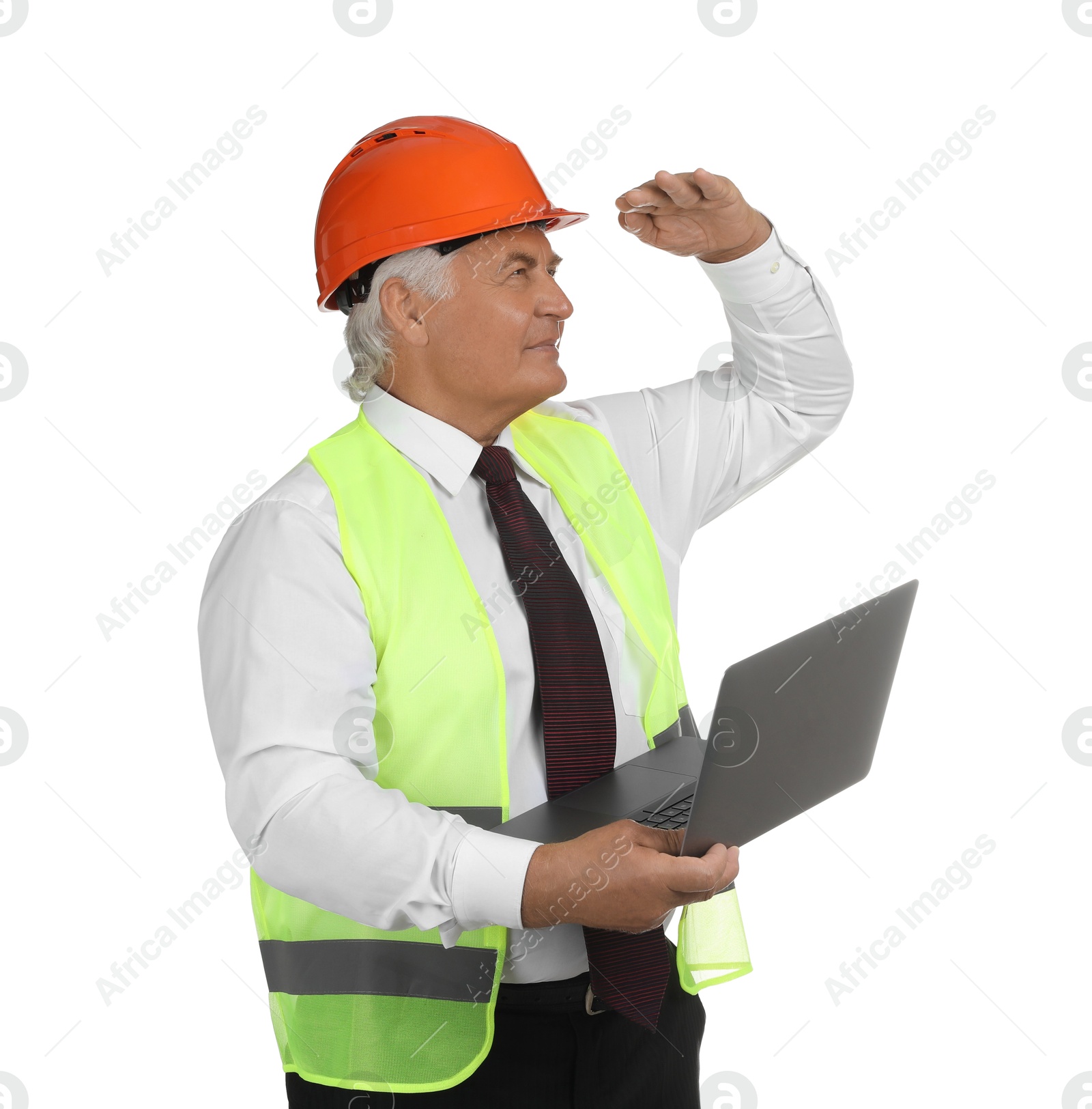 Photo of Engineer in hard hat with laptop on white background