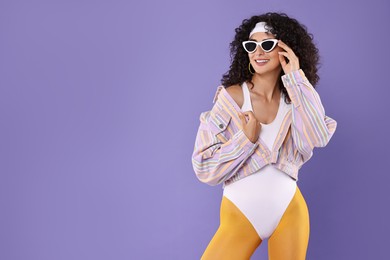 Photo of Aerobics. Happy woman in sunglasses on purple background, space for text