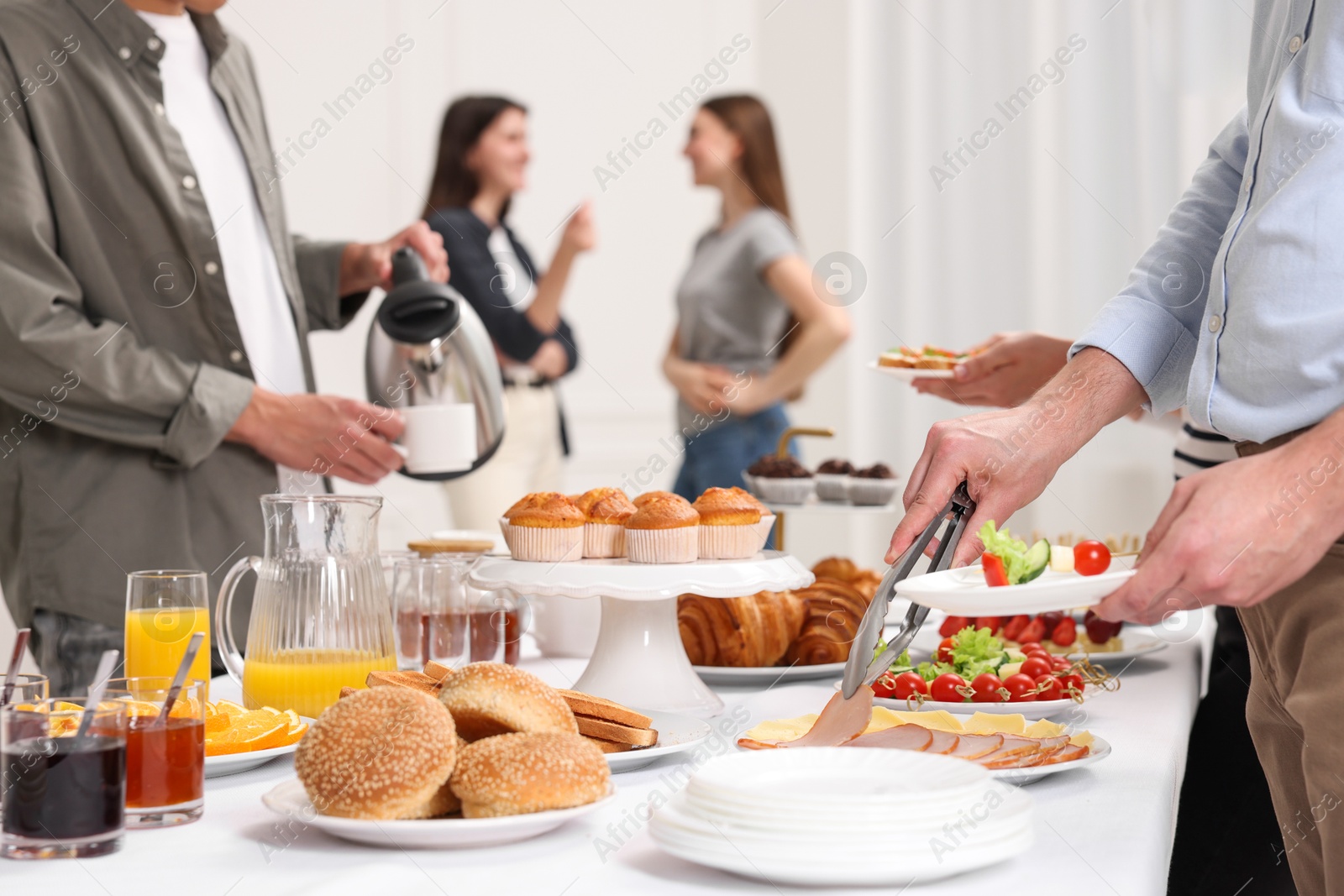 Photo of Coworkers having business lunch in restaurant, closeup