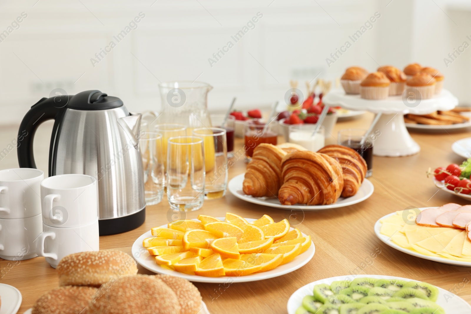 Photo of Different meals served on wooden table indoors. Buffet menu