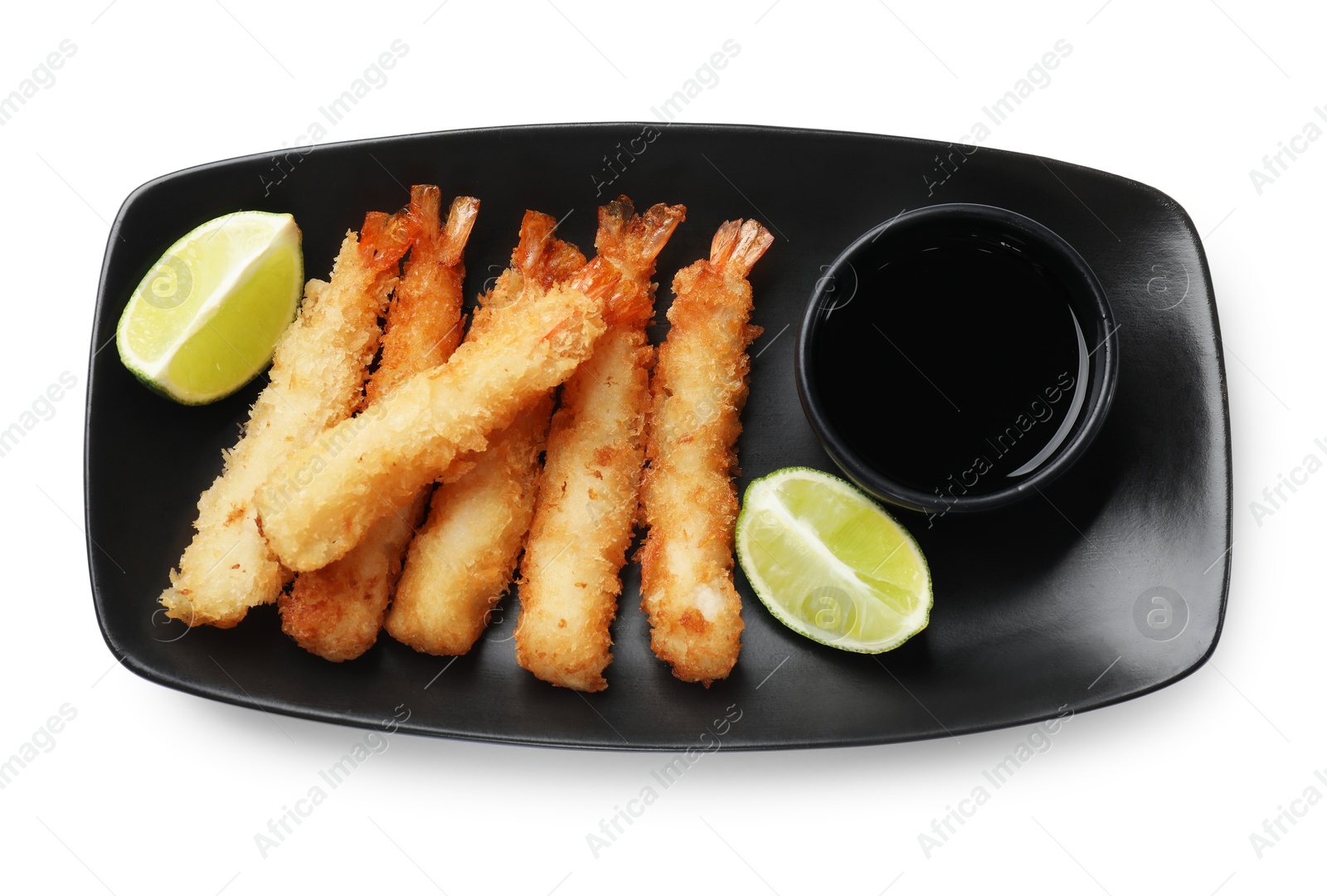 Photo of Delicious breaded fried shrimps with sauce isolated on white, top view