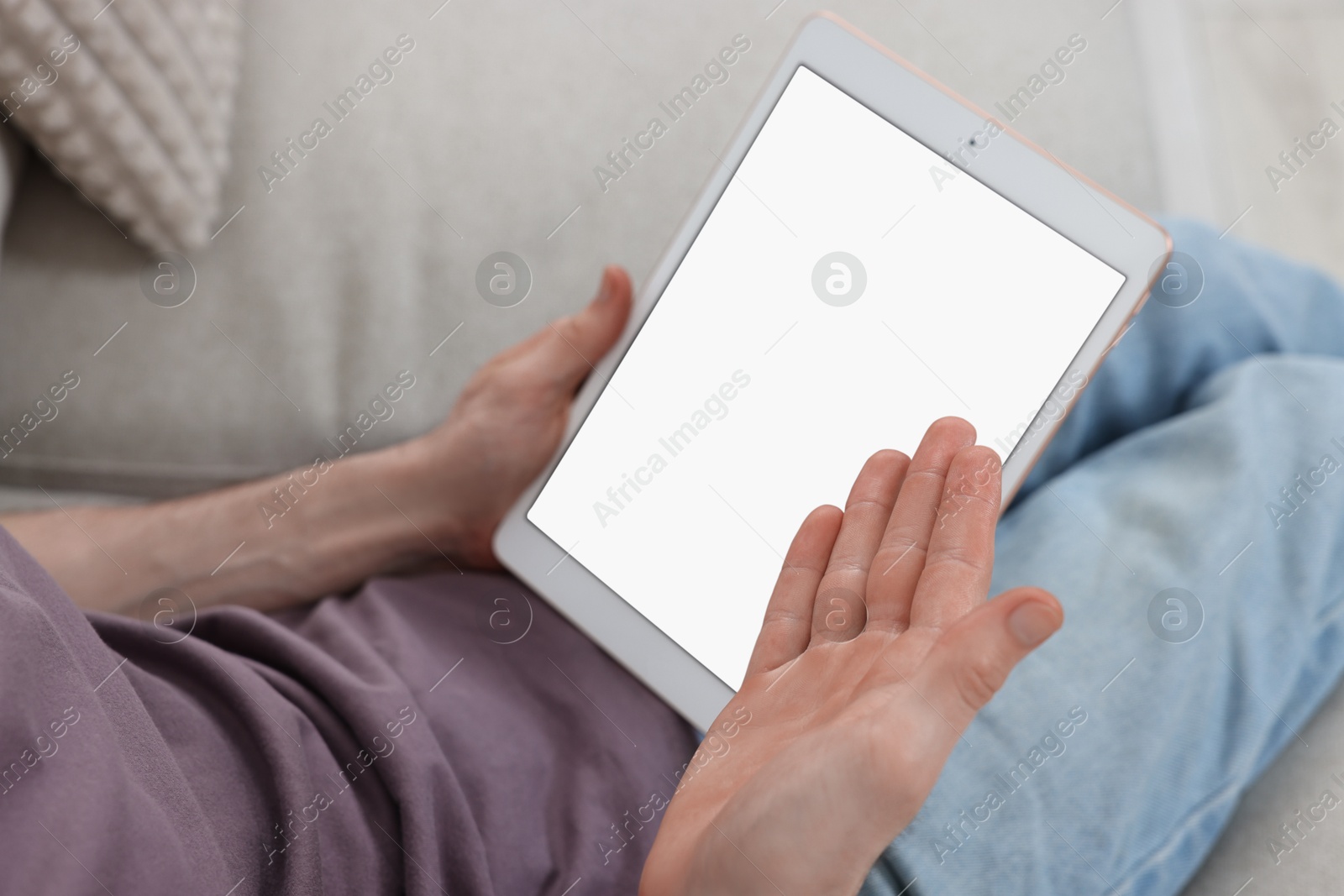 Photo of Sick man having online consultation with doctor via tablet at home, closeup