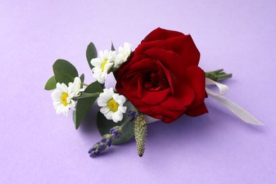 One small stylish boutonniere on violet background