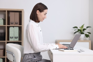 Woman with good posture working in office