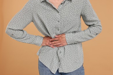 Photo of Indigestion problem. Woman suffering from stomachache, closeup