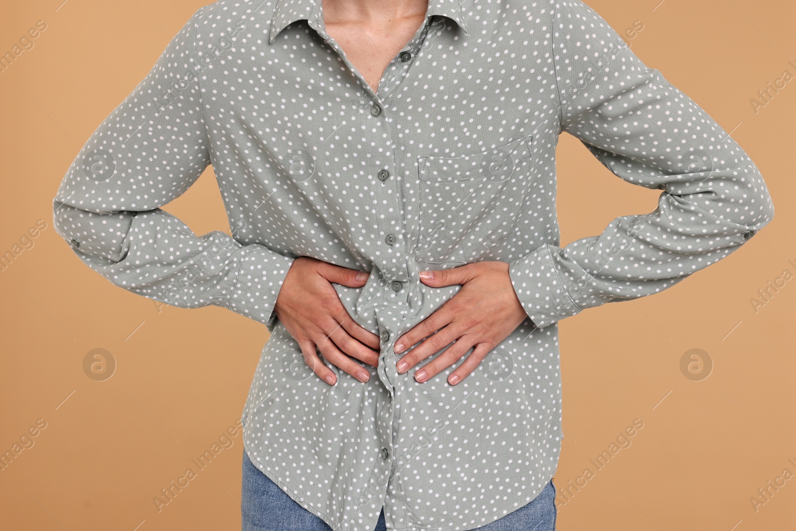 Photo of Indigestion problem. Woman suffering from stomachache, closeup