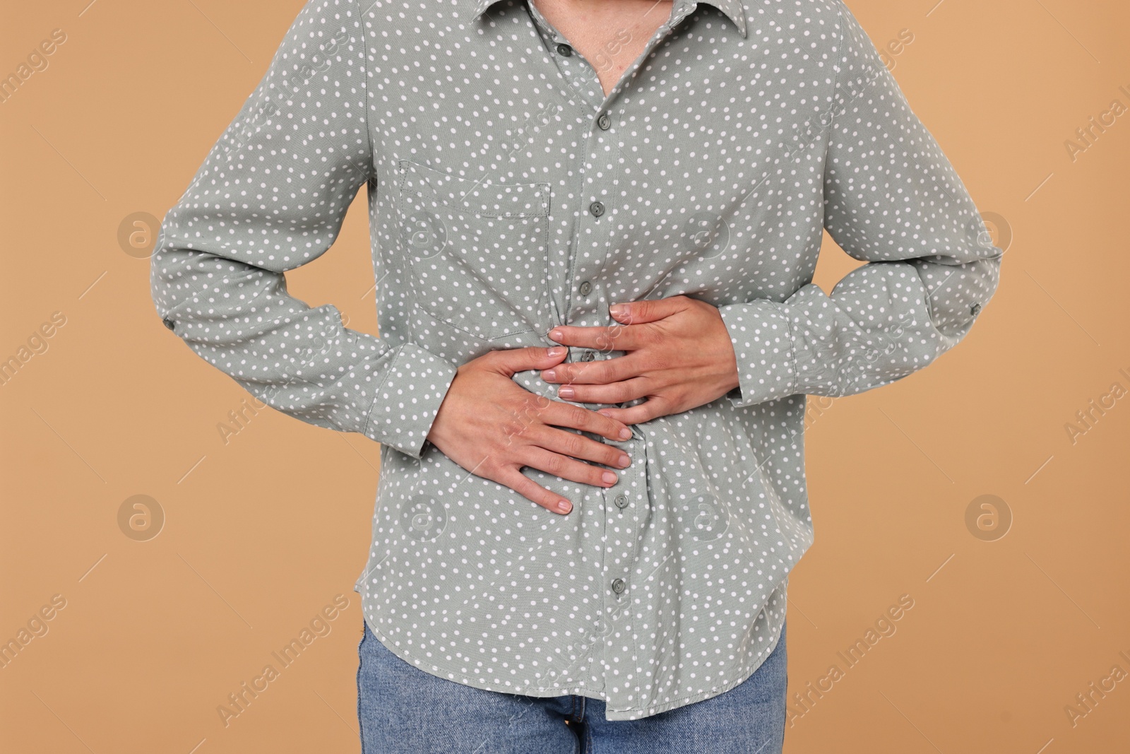 Photo of Indigestion problem. Woman suffering from stomachache, closeup