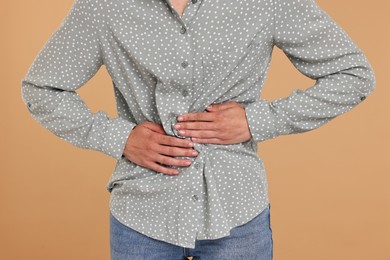 Photo of Indigestion problem. Woman suffering from stomachache, closeup