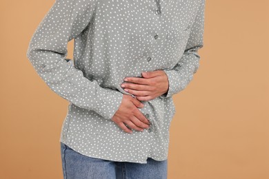 Photo of Indigestion problem. Woman suffering from stomachache, closeup