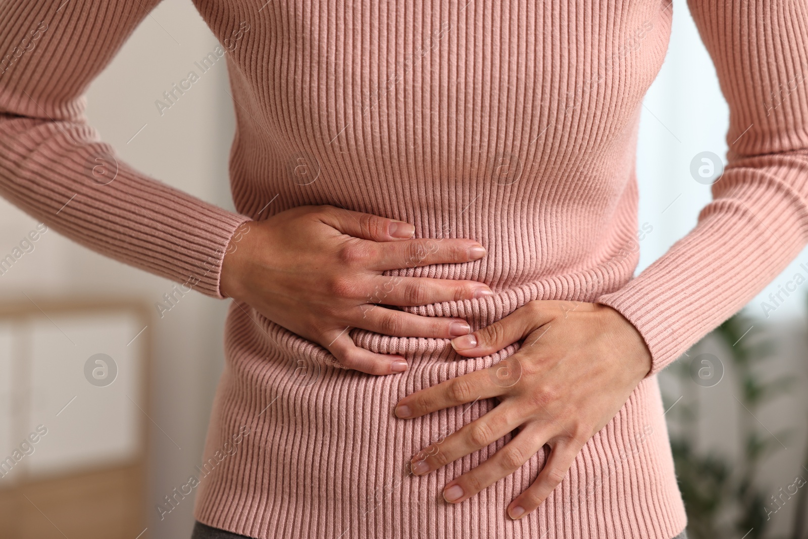 Photo of Indigestion problem. Woman suffering from stomachache, closeup