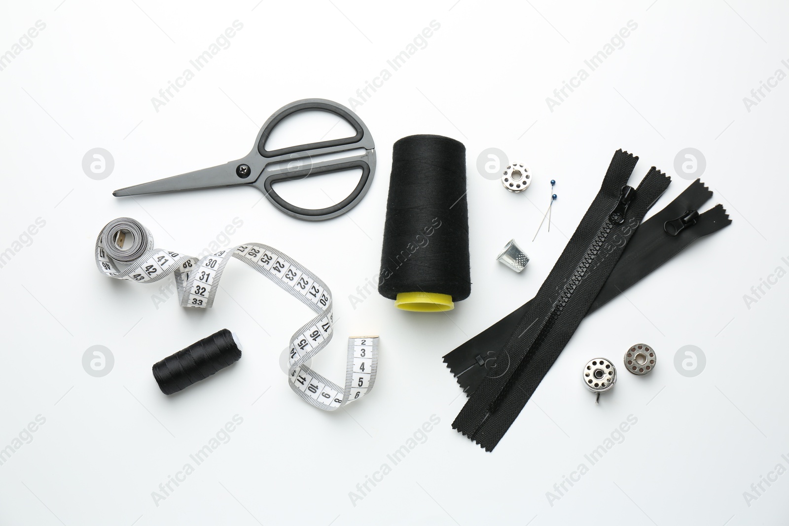 Photo of Flat lay composition with different sewing supplies on white background