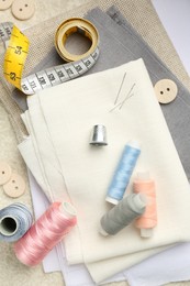 Photo of Flat lay composition with different sewing supplies on table