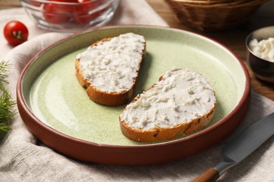 Delicious ricotta bruschettas and products on wooden table