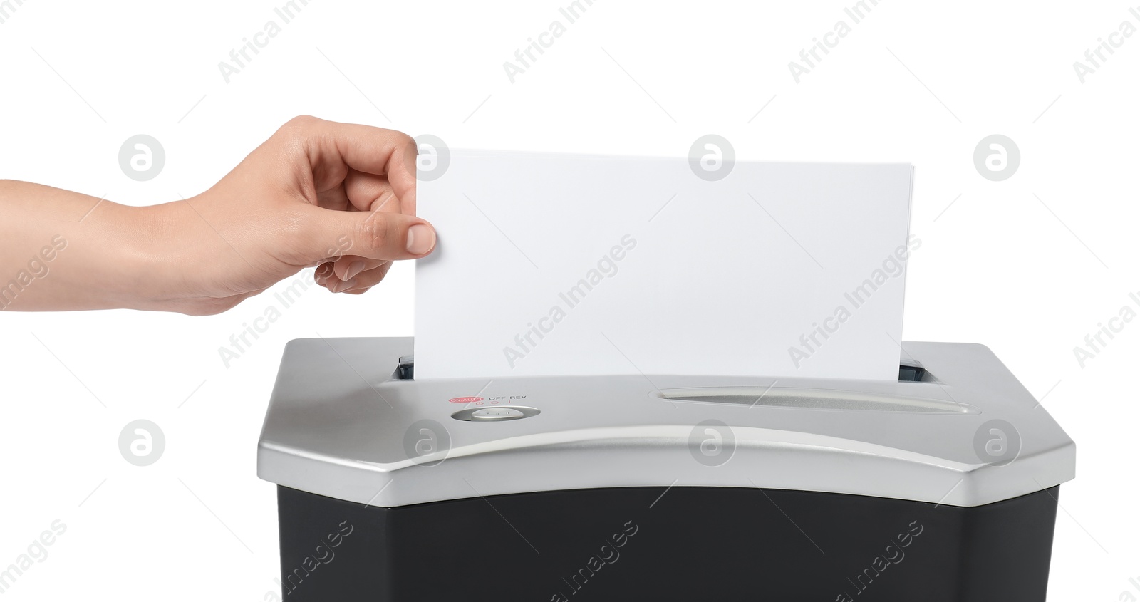 Photo of Woman destroying paper with shredder on white background, closeup