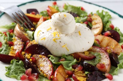 Photo of Fresh burrata salad with spices on plate, closeup