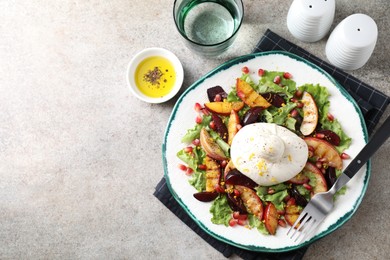 Photo of Plate with fresh burrata salad served on grey textured table, flat lay. Space for text