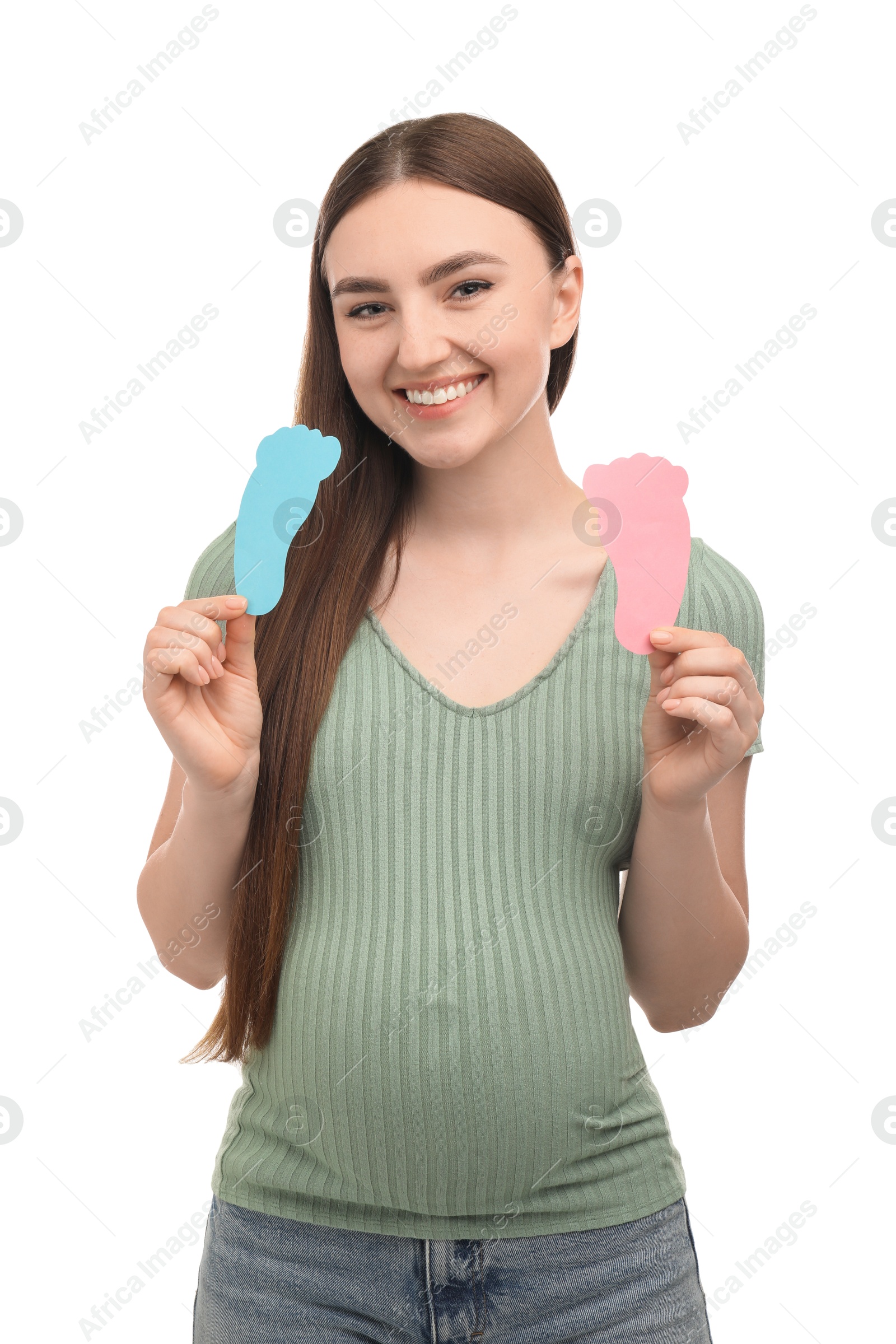 Photo of Expecting twins. Pregnant woman holding two paper cutouts of feet on white background