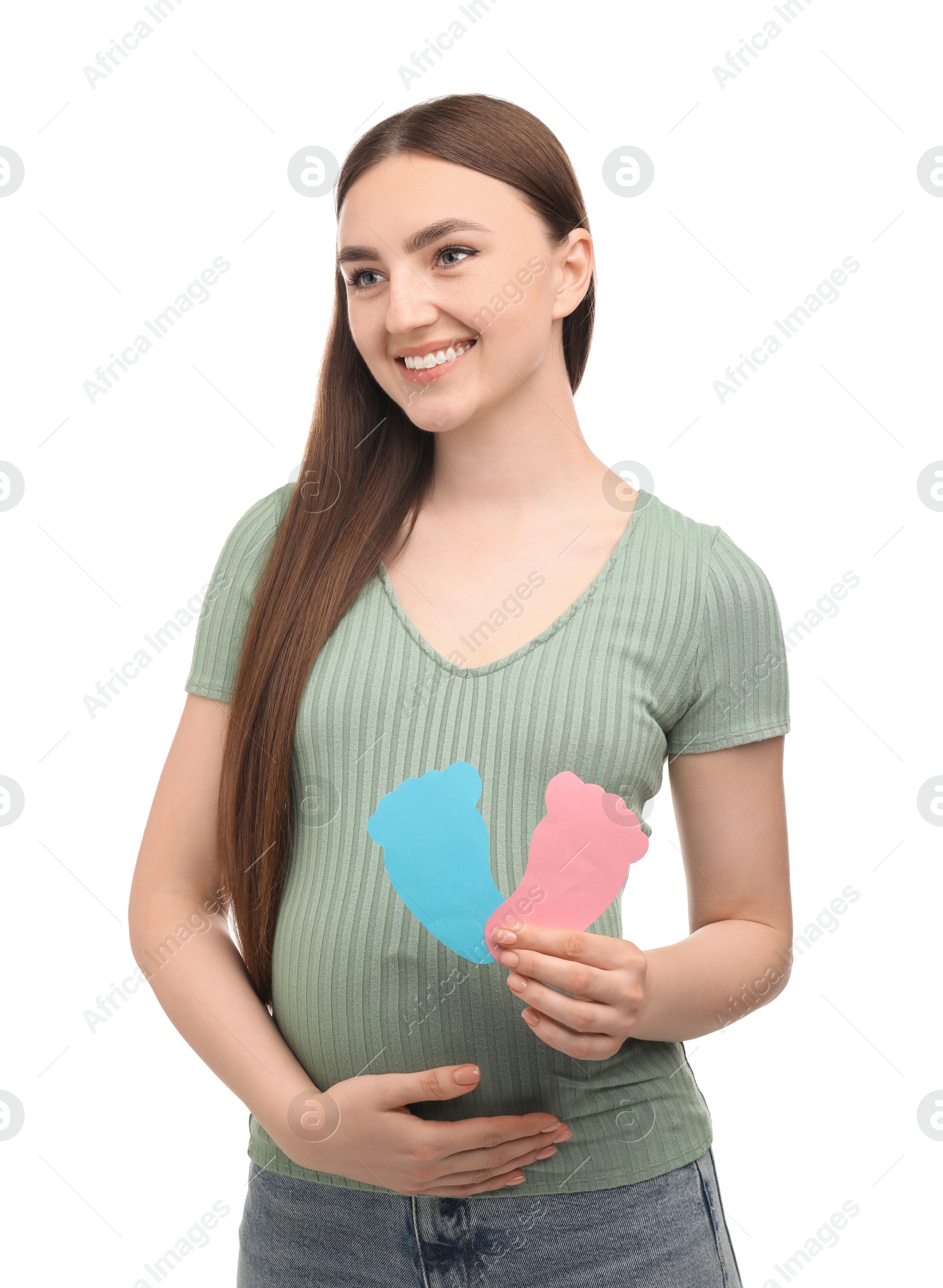 Photo of Expecting twins. Pregnant woman holding two paper cutouts of feet on white background