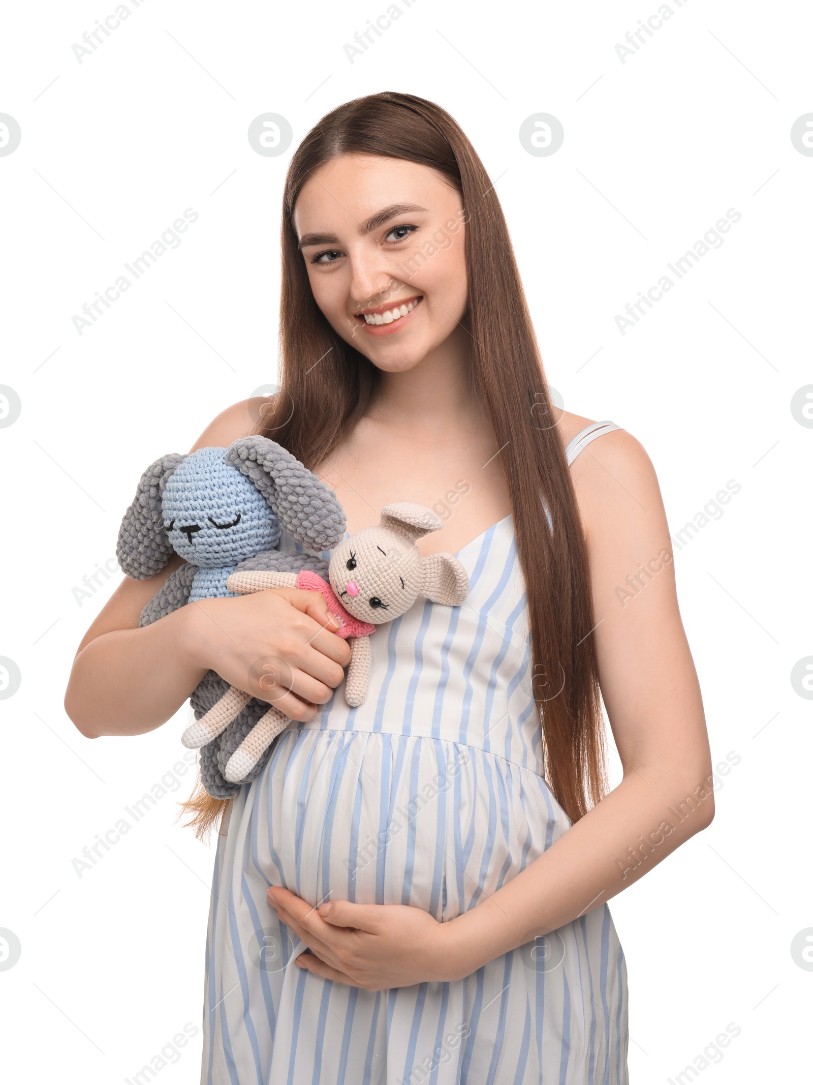 Photo of Expecting twins. Pregnant woman holding two toys on white background