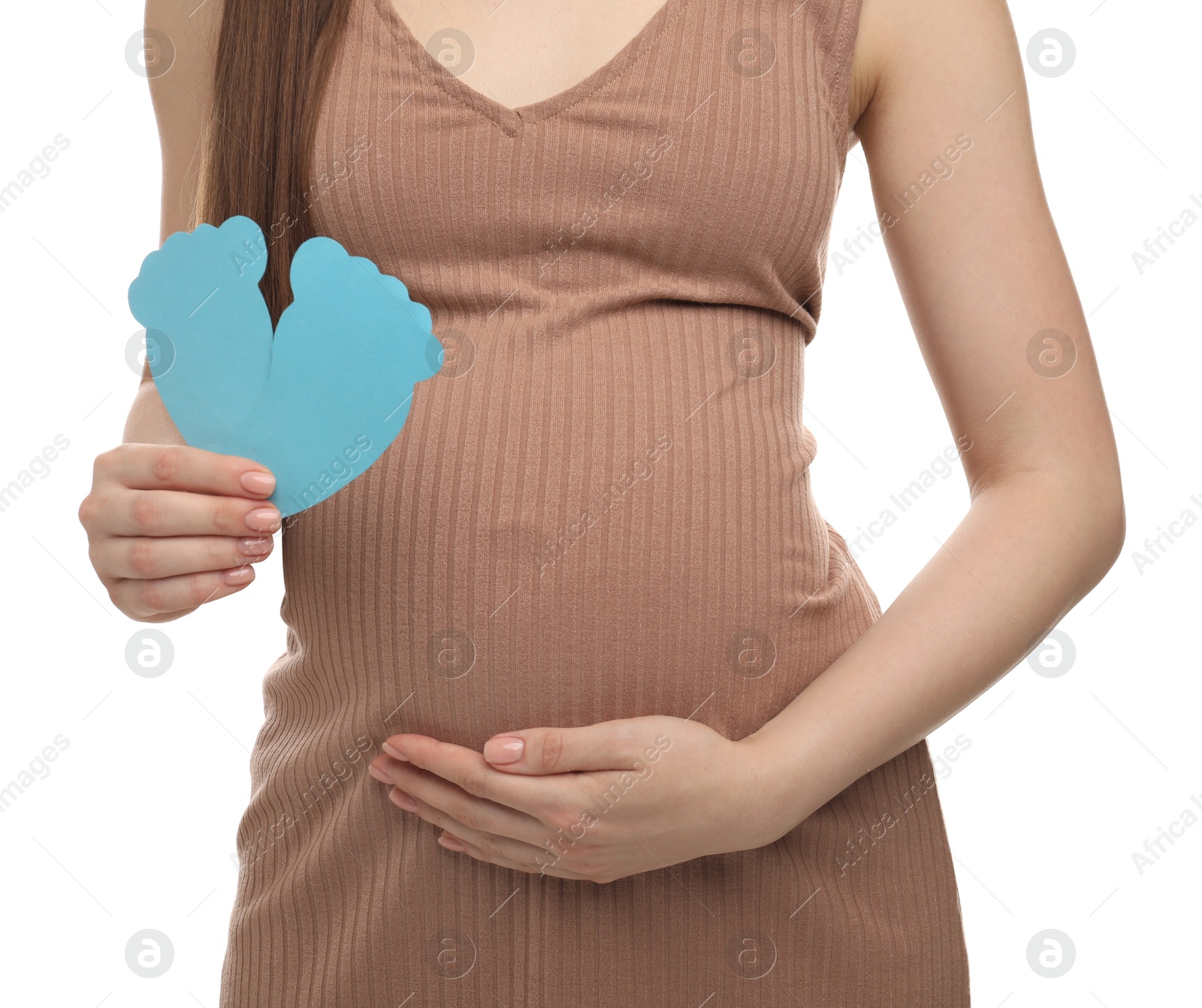 Photo of Expecting twins. Pregnant woman holding two paper cutouts of feet on white background, closeup