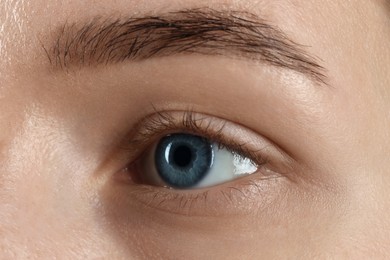 Photo of Woman with beautiful blue eyes, macro photo