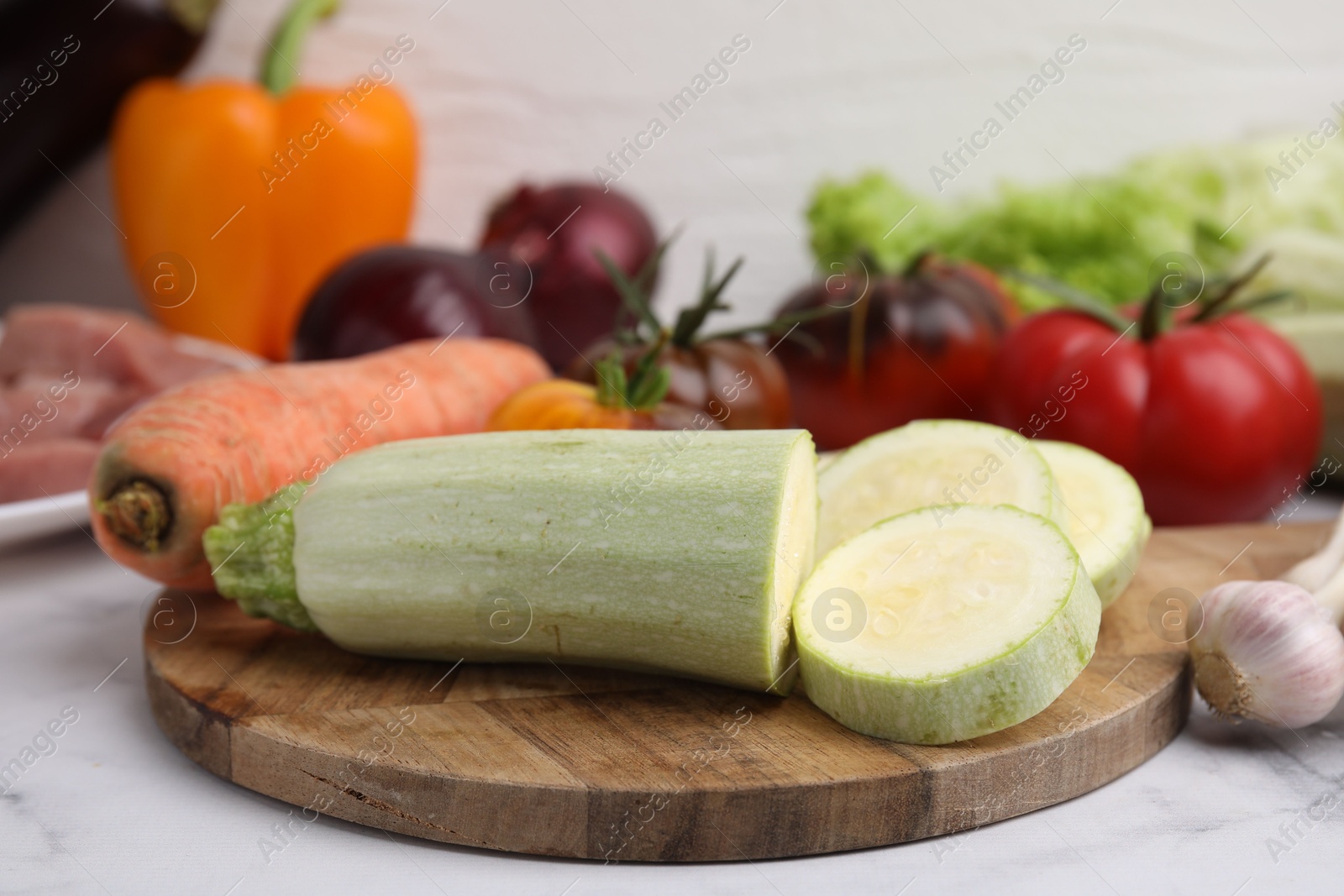 Photo of Cooking tasty stew. Different vegetables on white marble table