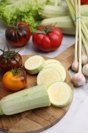 Photo of Cooking tasty stew. Different vegetables on white marble table