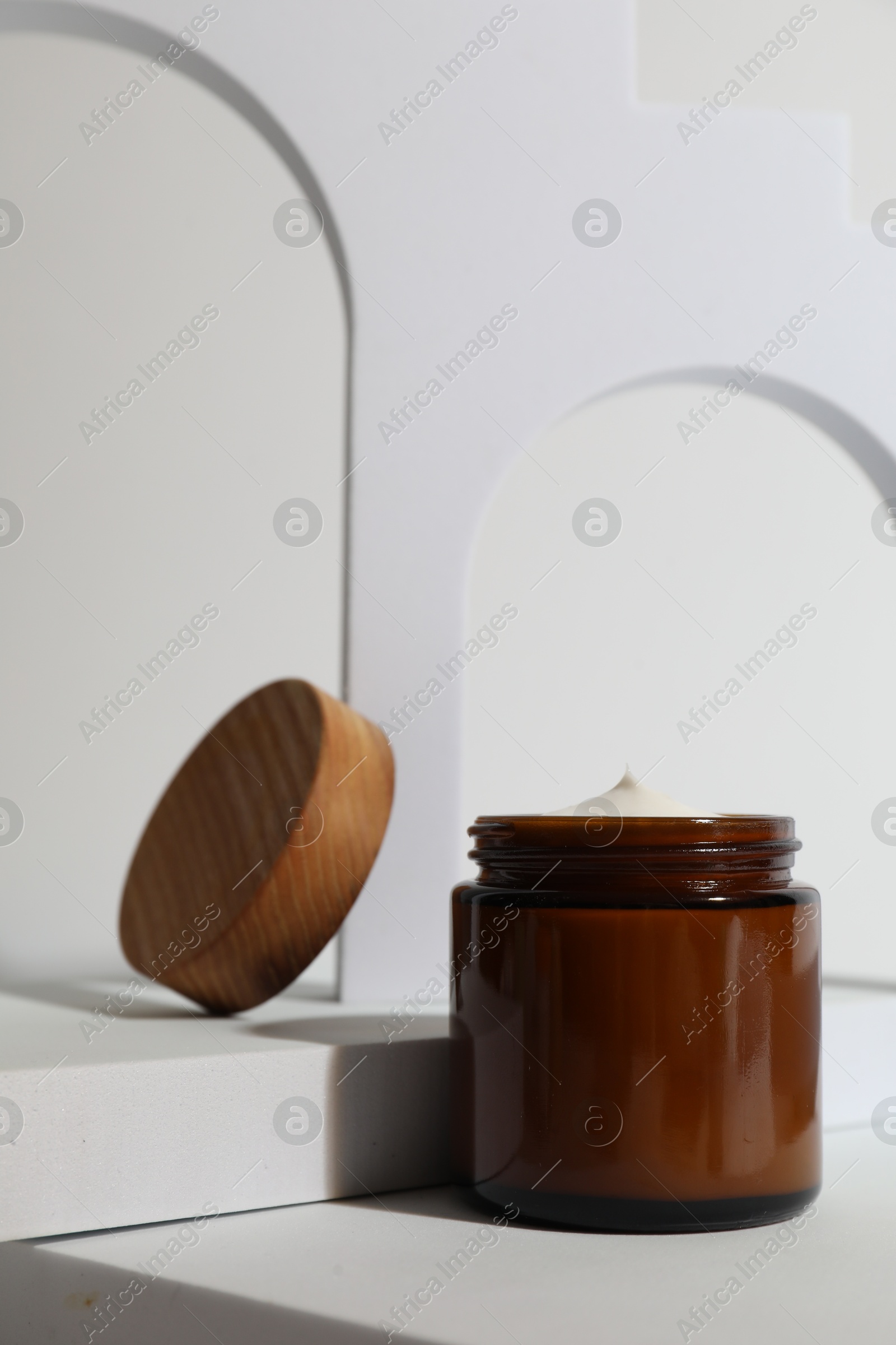 Photo of Stylish presentation of facial cream on white background