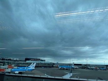 Photo of Haarlemmermeer, Netherlands - July 3, 2024: Modern airplanes in Amsterdam Airport Schiphol