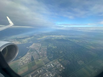 Photo of Picturesque view of city through plane window during flight