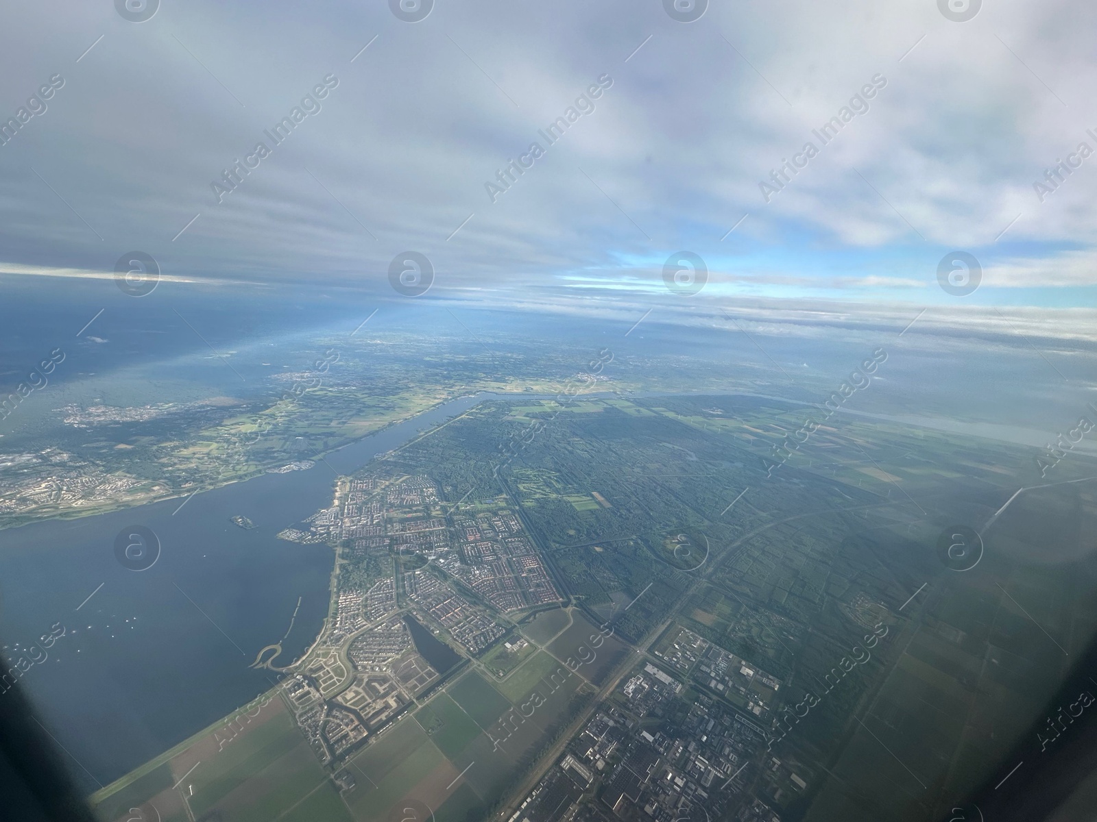 Photo of Picturesque view of city through plane window during flight