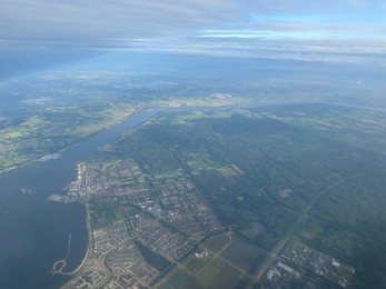 Photo of Picturesque view of city through plane window during flight