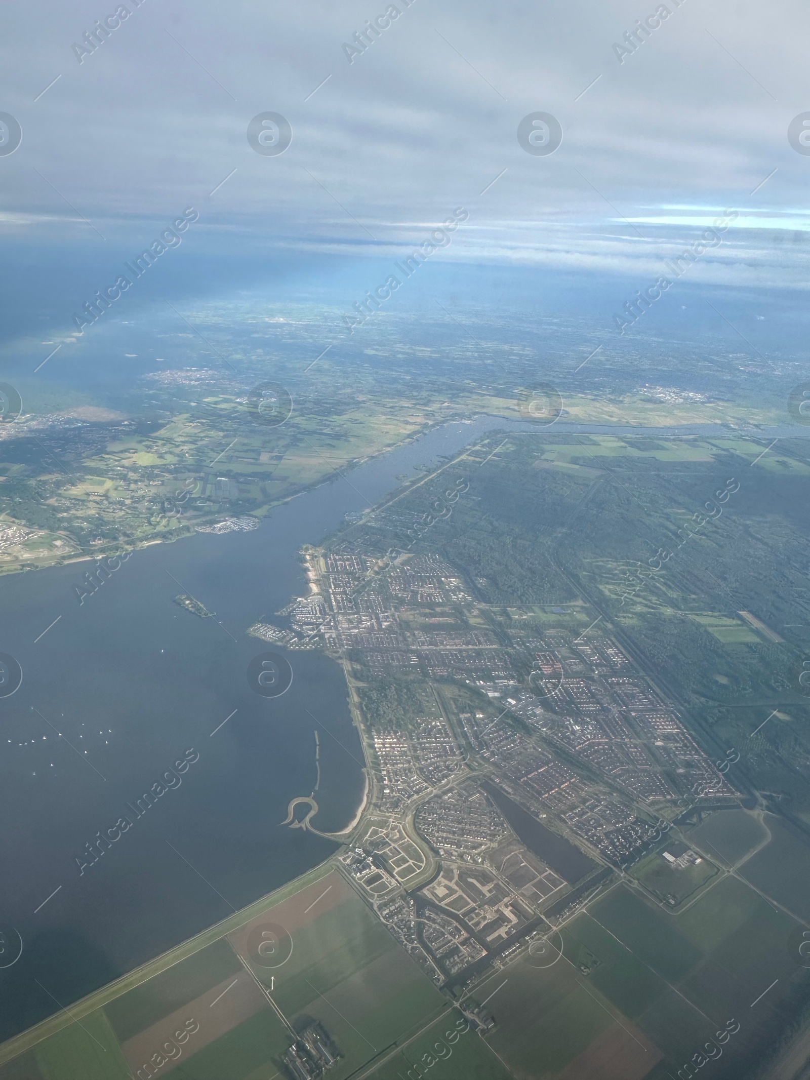 Photo of Picturesque view of city through plane window during flight