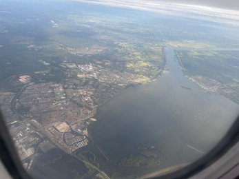 Photo of Picturesque view of city through plane window during flight