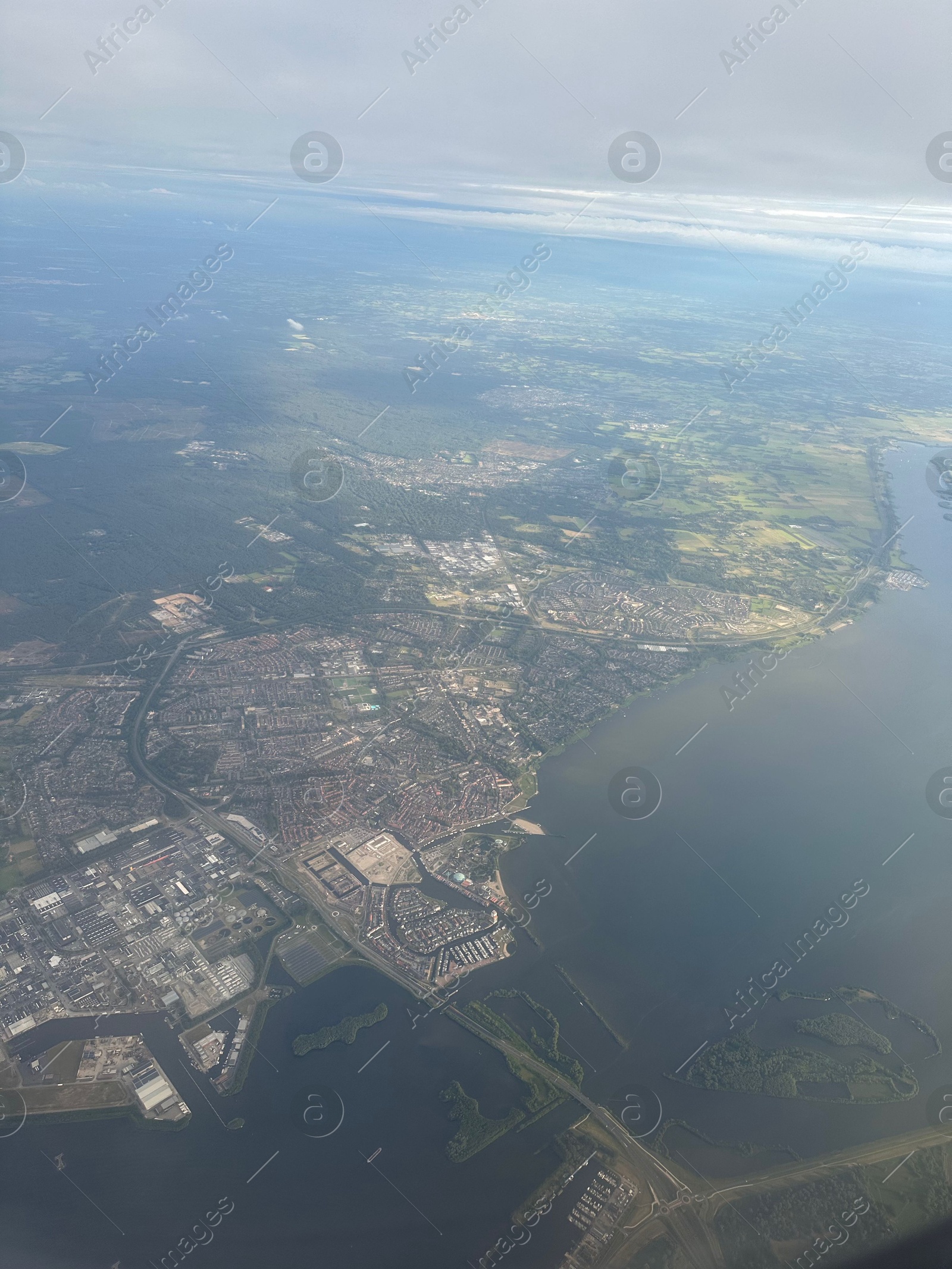 Photo of Picturesque view of city through plane window during flight