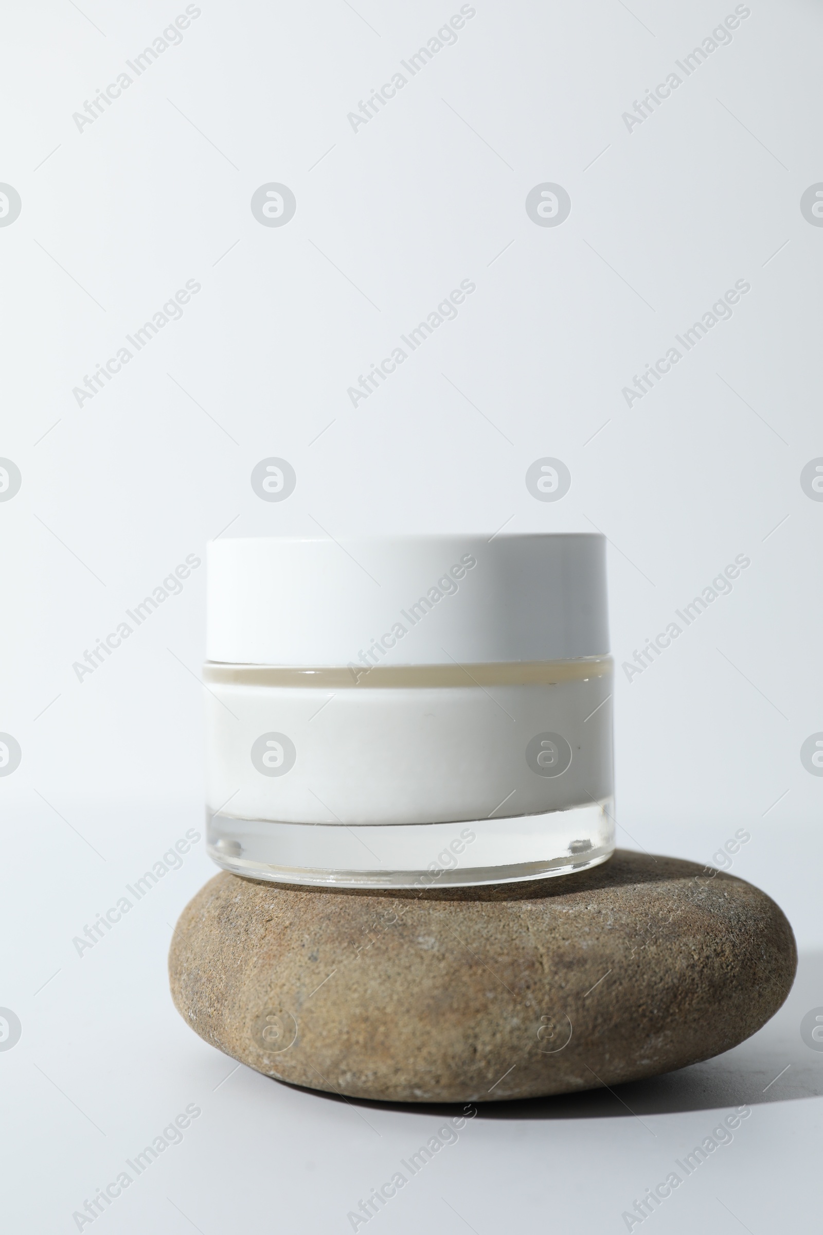 Photo of Stylish presentation of face cream on white background