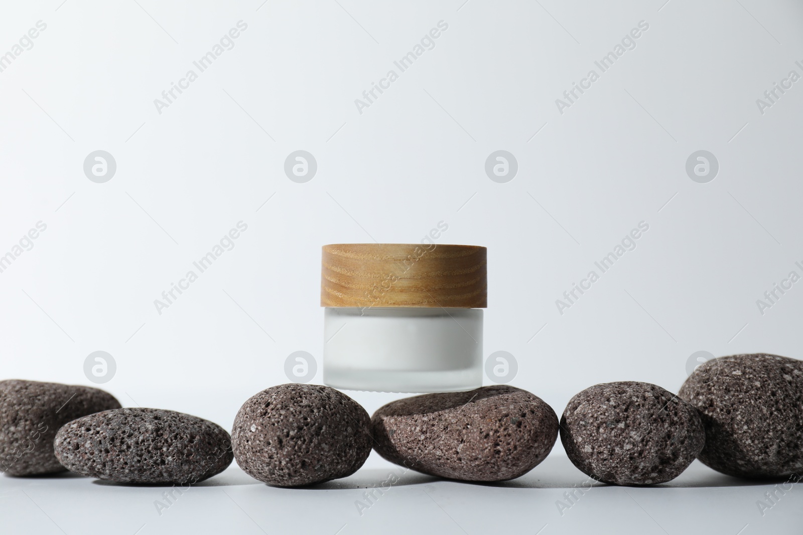 Photo of Stylish presentation of face cream on white background