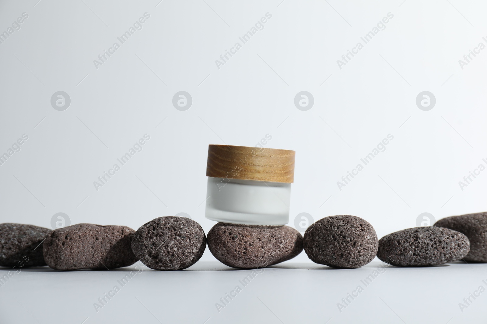 Photo of Stylish presentation of face cream on white background